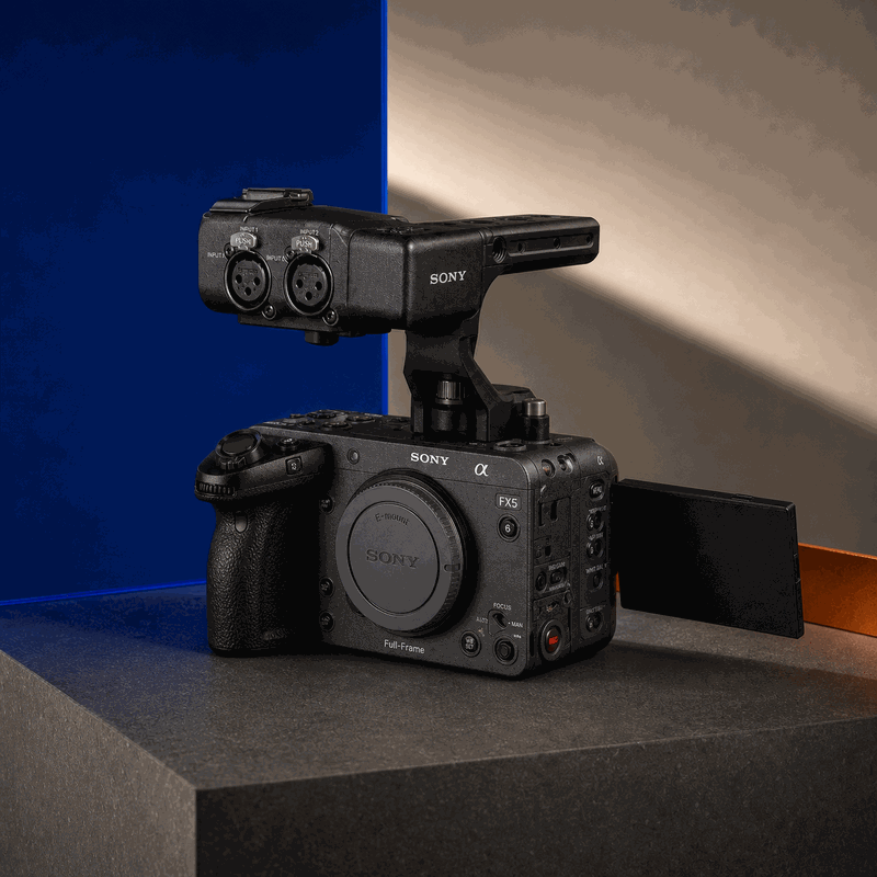 Sony FX5 compact cinema camera with XLR handle and body cap on the FRAMEHAUS cobalt and charcoal studio set